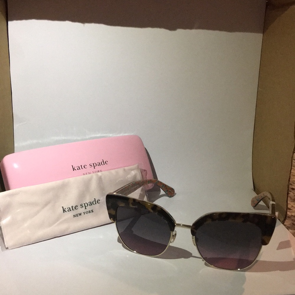 KATE SPADE sunglasses with wire and floral inside.